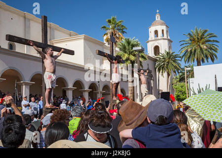 Tucson, Arizona - An annual Good Friday procession reenacts the crucifixion of Jesus. The procession begins at San Cosme Chapel and proceeds to the Ca Stock Photo