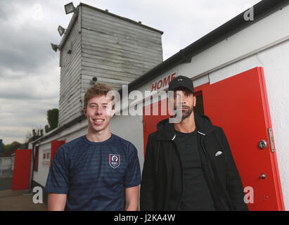 EDITORIAL USE ONLY Rio Ferdinand with Callum Airey as the former Manchester United and England footballer coaches the new football team Rebel FC ahead of their first match ever, against Slash Football FC at War Memorial Sports Ground in Sutton, south London. Stock Photo