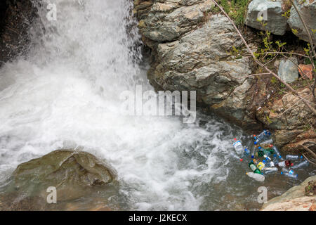 Plastic Bottles floating on a river Stock Photo