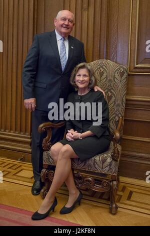 Former Georgia Gov. Sonny Perdue, left, poses with his wife Mary Ruff prior to being sworn in as the 31st U.S. Secretary of Agriculture at the Supreme Court April 25, 2017 in Washington, DC. Stock Photo
