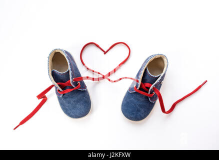 Baby shoes with laces forming heart