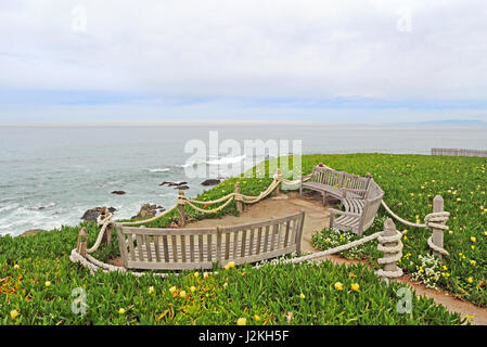 Benches facing the Pacific Ocean at Point Montara Fog Signal and Light Station State Park off of Highway 1 approximately 25 miles south of San Francis Stock Photo