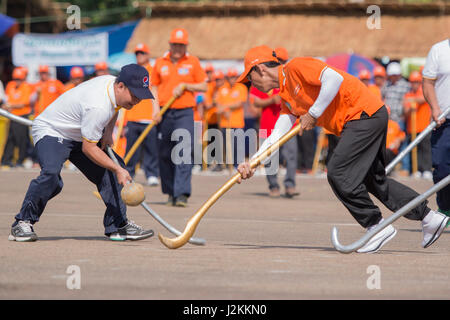 a Game of the traditional Hockey Tikhy or Lao Hockey at a ceremony at the Pha That Luang Festival in the city of vientiane in Laos in the southeastasi Stock Photo