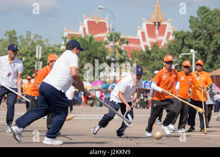 a Game of the traditional Hockey Tikhy or Lao Hockey at a ceremony at the Pha That Luang Festival in the city of vientiane in Laos in the southeastasi Stock Photo