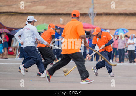 a Game of the traditional Hockey Tikhy or Lao Hockey at a ceremony at the Pha That Luang Festival in the city of vientiane in Laos in the southeastasi Stock Photo