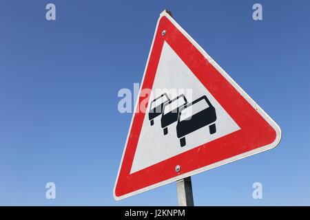 Caution queues likely road sign Stock Photo - Alamy
