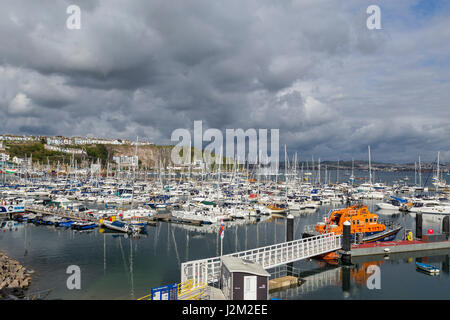 View across Brixham Harbour and Marina, with the RNLI Torbay lifeboat moored, in South Devon, UK Stock Photo