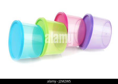 Colorful Round Plastic Containers Lying on White Background Stock Photo