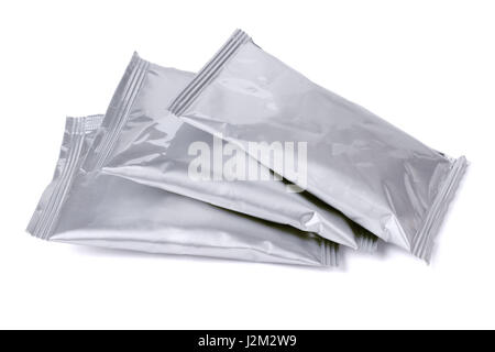 Sealed Aluminum Sachets Lying on White Background Stock Photo