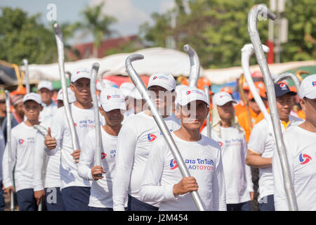 a Game of the traditional Hockey Tikhy or Lao Hockey at a ceremony at the Pha That Luang Festival in the city of vientiane in Laos in the southeastasi Stock Photo