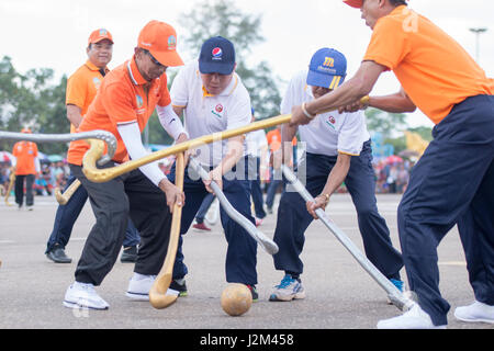 a Game of the traditional Hockey Tikhy or Lao Hockey at a ceremony at the Pha That Luang Festival in the city of vientiane in Laos in the southeastasi Stock Photo