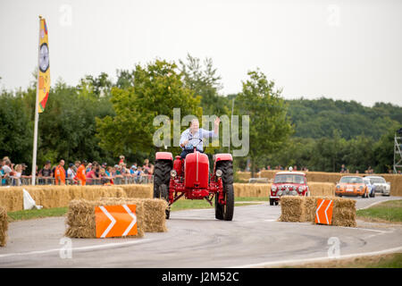 Laverstoke Park Farm, Overton, Basingstoke, Hampshire, United Kingdom. 27 August 2016. Jody Sheckter drives his vintage tractor on the hill climb track at Radio 2 breakfast show DJ, Chris Evans' Car Fest South 2016 - Car, Food, Family and Music Festival for BBC Children in Need. © Will Bailey / Alamy Stock Photo