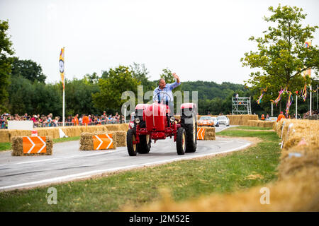 Laverstoke Park Farm, Overton, Basingstoke, Hampshire, United Kingdom. 27 August 2016. Jody Sheckter drives his vintage tractor on the hill climb track at Radio 2 breakfast show DJ, Chris Evans' Car Fest South 2016 - Car, Food, Family and Music Festival for BBC Children in Need. © Will Bailey / Alamy Stock Photo