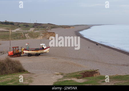 Weybourne beach, north Norfolk, with crab fishing boat and launching tractor. Stock Photo