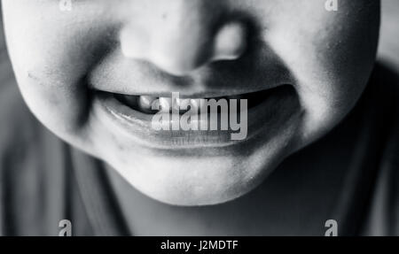 A small baby boy  showing his teeth Stock Photo