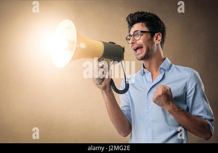 Man yelling with megaphone Stock Photo