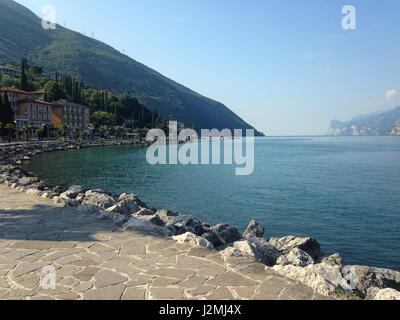 Lake Garda is the largest lake in Italy. It is located in Northern Italy, about half-way between Brescia and Verona, and between Venice and Milan. Stock Photo