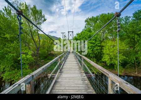 Swinging pedestrian bridge over the James River in Buchanan, Virginia. Stock Photo