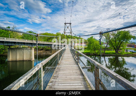 Swinging pedestrian bridge over the James River in Buchanan, Virginia. Stock Photo