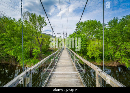 Swinging pedestrian bridge over the James River in Buchanan, Virginia. Stock Photo