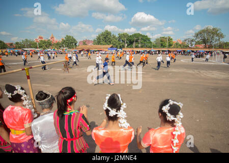 a Game of the traditional Hockey Tikhy or Lao Hockey at a ceremony at the Pha That Luang Festival in the city of vientiane in Laos in the southeastasi Stock Photo