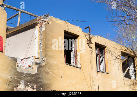 Destroyed Building. The beginning of a new day. Stock Photo