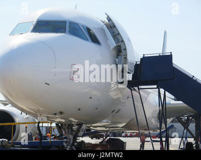 Aerobridge in plane parked in the airport waiting for passengers Stock Photo