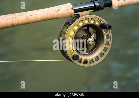 Close up of a fly fishing reel on a rod Stock Photo