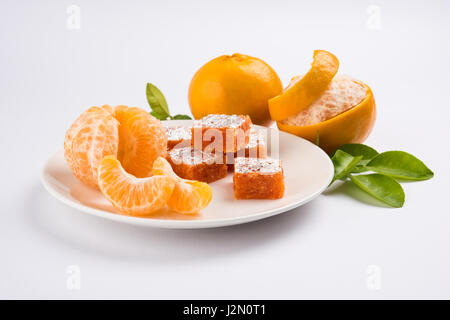 indian sweet food Orange Burfi or orange cake or santra burfi in hindi, favourite festival food from central india Stock Photo