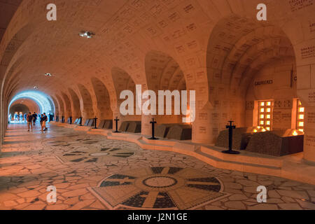 VERDUN, FRANCE - AUGUST 19, 2016: Visitors in the Douaumont Ossuary, a memorial containing the remains of soldiers died during the Battle of Verdun in Stock Photo