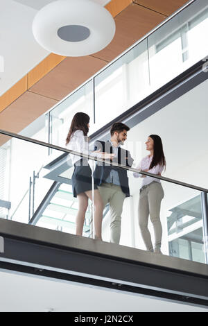 Professionals business colleagues collaborating and discussing project plans Stock Photo