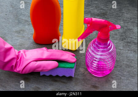 Spring cleaning concept with supplies over floral background macro