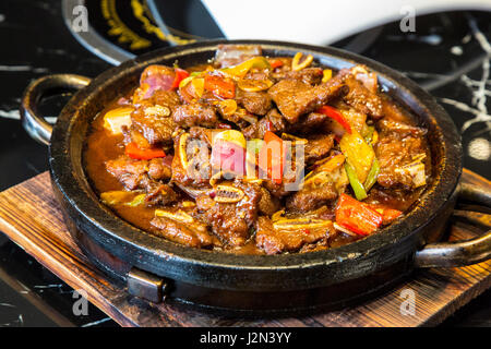 Guizhou, China.  Lunch of Sweet and Sour Pork and vegetables. Stock Photo