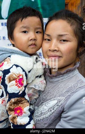 Matang, a Gejia Village in Guizhou, China.  Mother and Young Daughter. Stock Photo