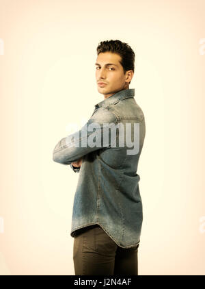Confident, attractive young man with denim shirt Stock Photo