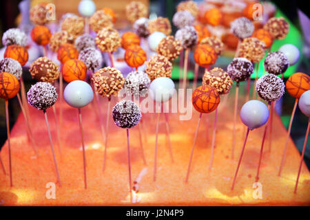 Various colorful sweetness balls on sticks Stock Photo