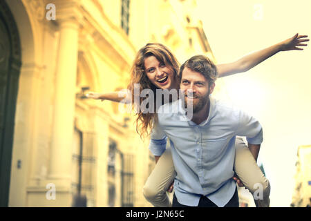 Man giving woman a piggyback Stock Photo