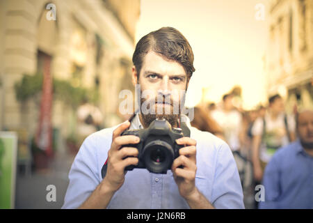 Bearded man with camera Stock Photo