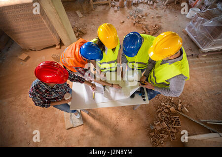 Top view of construction team with colorful hard hat on building construction Stock Photo