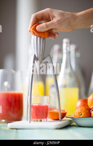 Orange juicing Stock Photo