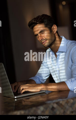 Journalist working on modern laptop at home, closeup. Coronavirus ...