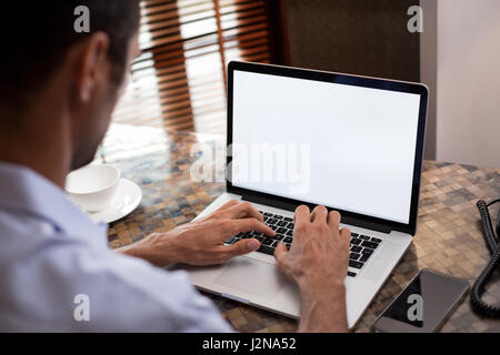 Man working on laptop he looking in empty screen Stock Photo