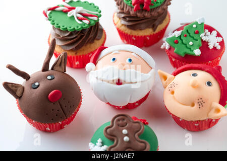 Colorful decorative Christmas cupcakes  with candy elements on top Stock Photo