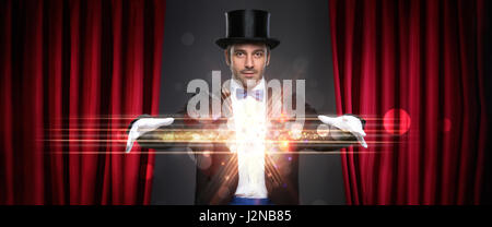 magician showing trick on stage, magic, performance, circus, show concept Stock Photo