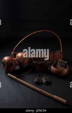 Set of african musical instruments isolated on dark background Stock Photo