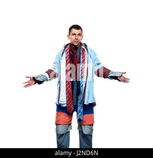 Male buyer dressed in many different clothes isolated on white background. Man trying on various shirts, ties, pants and shorts. Shopping concept. Clo Stock Photo