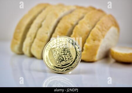 Physical cryptocurrency coin gold titan bitcoin and bread Stock Photo