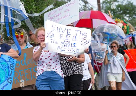 Charleston, South Carolina, USA. 29th Apr, 2017. Protesters hold signs as they march in the People's Climate Parade in solidarity with similar marches around the nation April 29, 2017 in Charleston, South Carolina. The march coincides with the 100th day in office of President Donald Trump and demands action to protect the environment and stop climate change. Credit: Planetpix/Alamy Live News Stock Photo