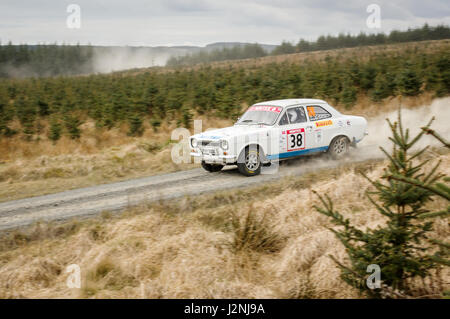 Wark, UK - 29th April, 2017: Rally car taking part in the Pirelli International Rally 2017 (Historic Section).  Driver Stuart Cariss and Co-Driver Linda Cariss in a Ford Escort Sport. Stock Photo