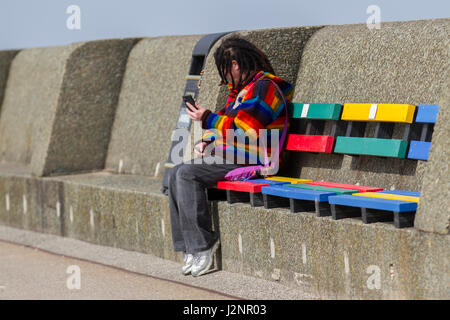 New Brighton, Wallasey, UK.  UK Weather.  30th April, 2017. Sunny with gusty winds in the resort and light windborne sand causing irritation to tourists enjoying the beach promenade at low water. Credit; MediaWorldImages/AlamyLiveNews Stock Photo